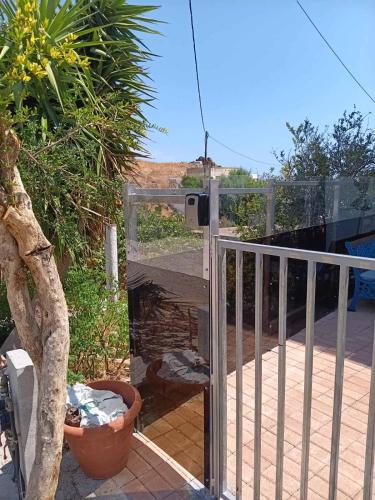 a balcony with a gate with a camera on it at Lendas Paradise studio number 1 in Léntas