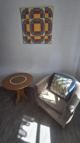 a living room with a couch and a table at Dom Pracy Twórczej in Gryfice