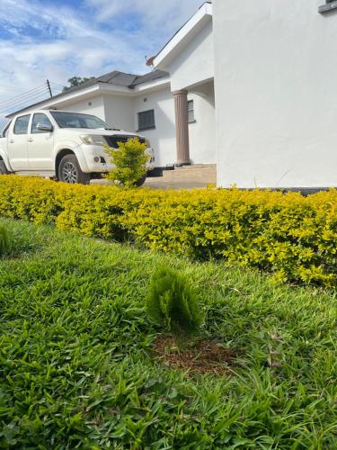 a white truck parked in front of a house at 47 The Heights, Area 47, Sector 1, Lilongwe in Lilongwe