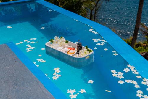 a toy boat on top of a swimming pool at Bintana Sa Paraiso in Mambajao