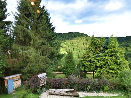 a view of a garden with trees and flowers at Gruppen- Ferienhaus in Wieda in Wieda