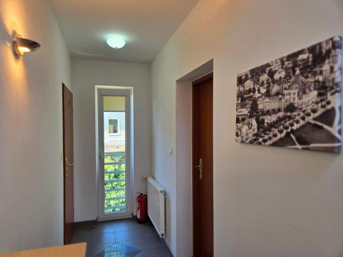 a room with a hallway with a painting on the wall at Willa Mira 200 metrów od morza in Międzyzdroje
