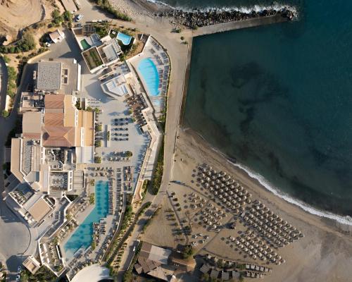 an overhead view of a beach with buildings and the ocean at Fodele Beach Water Park Resort in Fodele