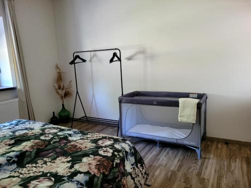a bedroom with a bed and a desk with a lamp at Kastély Ház in Sály