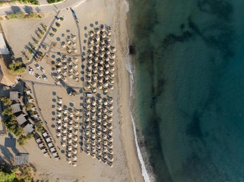 an overhead view of a beach with a group of docked ships at Fodele Beach Water Park Resort in Fodele