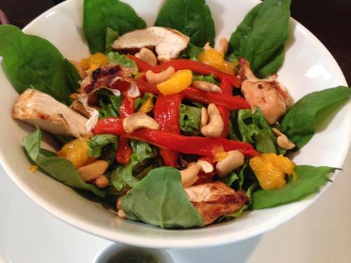 a salad in a white bowl on a table at La Riviera Hotel in San Antonio