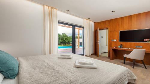 En eller flere senge i et værelse på Villa Istria Green by Villas Holiday