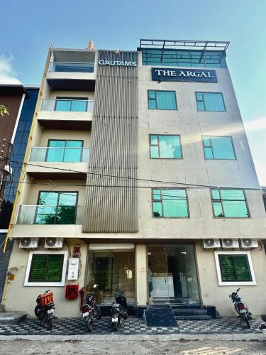 a building with motorcycles parked in front of it at Hotel The Argal By Basotel, Vijay Nagar in Indore