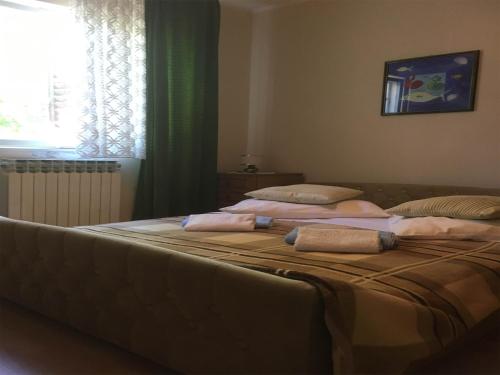 Postel nebo postele na pokoji v ubytování Guesthouse Villa Manda