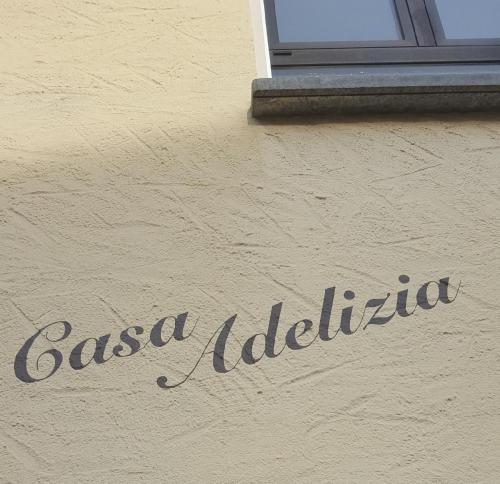 a sign on the side of a building at Casa Adelizia in Ascona