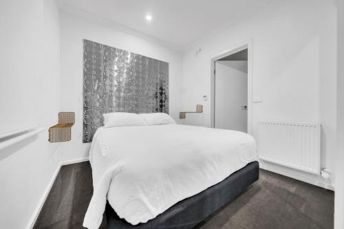Ένα ή περισσότερα κρεβάτια σε δωμάτιο στο Grosvenor 3121 Richmond