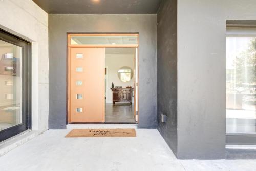an empty hallway with a door with a welcome mat at Black Sheep Hideaway Modern Countryside Serenity in Clermont