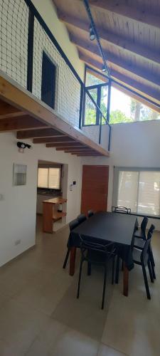 a ping pong table in a room with a staircase at Alto del pinar in Mar Azul