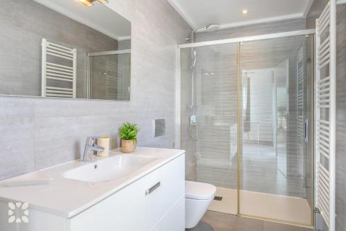 a bathroom with a white sink and a shower at Villa Chic Romance by Abahana Villas in Fanadix