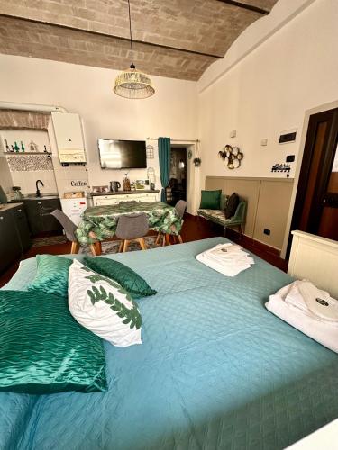 a bedroom with a large bed with two pillows on it at VerdeNera in Terni