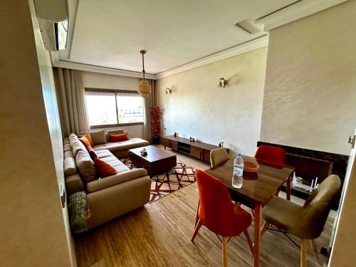a living room with a couch and a table at Ocean side - Prestige & Douceur familliale in Casablanca