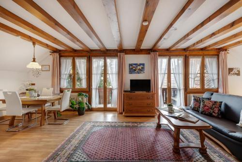a living room with a couch and a table at Gästehaus Weingut Mangel in Endingen