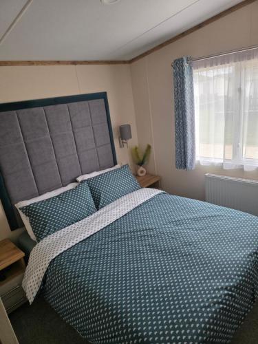 Ένα ή περισσότερα κρεβάτια σε δωμάτιο στο Hawthorn Lodge