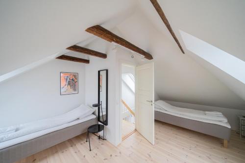 a bedroom with two beds in a attic at 4-BR apartment with a balcony in Hellerup - 182 in Hellerup