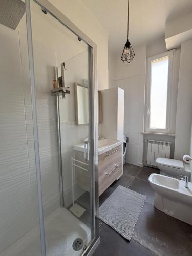 a bathroom with a shower and a sink at Salso Experience apartment in Salsomaggiore Terme