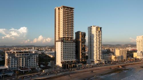 a view of a city with tall buildings at Holiday Inn Express & Suites Mazatlan by IHG in Mazatlán