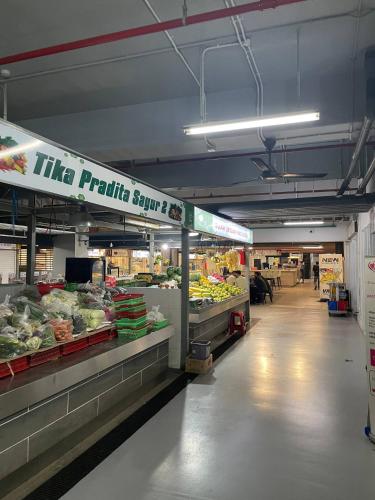 a produce section of a grocery store with fruits and vegetables at Tokyo River side PIK2 By Micky Studio 4 in Muara