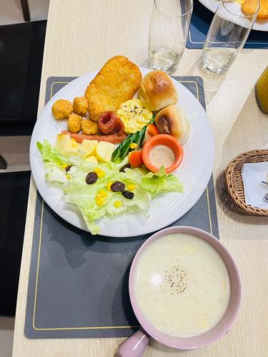 a white plate of food on a table at Ci Yun Ji B&B慈雲居民宿 in Jian