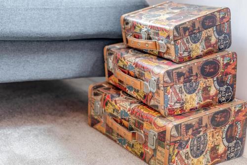 a stack of suitcases stacked on top of each other at 2 Bed in Lostwithiel oc-m32537 in Lostwithiel