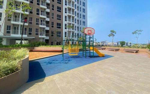 a playground with a basketball hoop in front of a building at Tokyo River side PIK2 By Micky Studio 5 in Muara