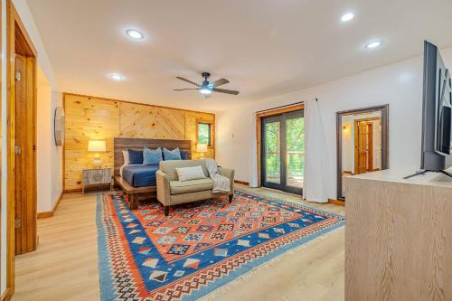 a bedroom with a bed and a couch and a television at Fall Break+Family Cabin+Game Room+Fire Pit+Hot Tub in Wear Valley