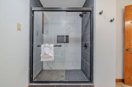 a walk in shower with a glass door at Fall Break+Family Cabin+Game Room+Fire Pit+Hot Tub in Wear Valley