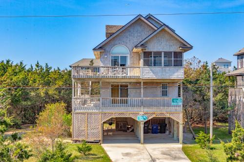 a large house with a balcony on top of it at Hatteras High 65 in Frisco