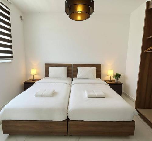 Ένα ή περισσότερα κρεβάτια σε δωμάτιο στο St Julian apartment number 8