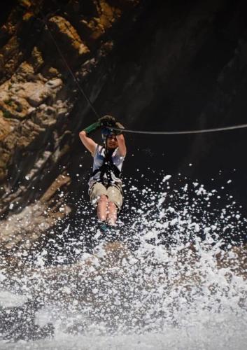 a person on a rope in the water at Stylish OceanBreeze 50 Central Mossel Bay in Mossel Bay