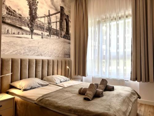 a bedroom with a bed with two towels on it at Michalczyka 3A - Self Check-In 20h - Parking in Wrocław