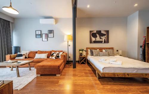 a living room with a bed and a couch at Benesta Guest Teori in Istanbul