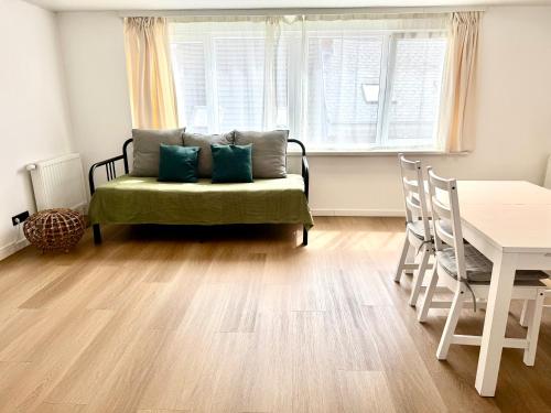 a living room with a couch and a table at Home in Antwerp city center in Antwerp