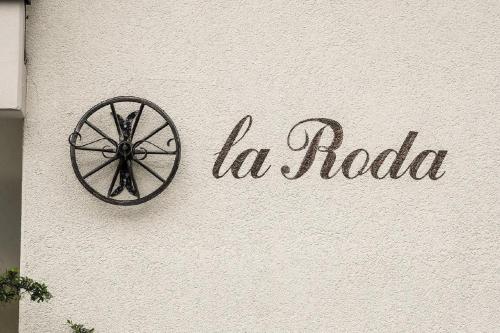 a sign for la radio on the side of a building at Casa La Roda Ursin in Sedrun