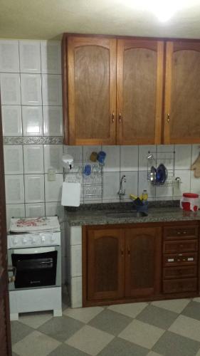 A kitchen or kitchenette at Hospedaria - Hostel Gamboa