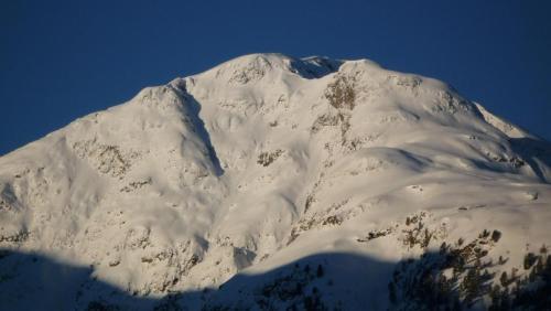 a mountain covered in snow on a clear day at Chesa Vista Mezdi 6 Bergbahnen Sommer Und Öv Inklusive in Pontresina