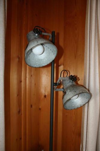 a couple of lights hanging on a wall at Fewo Mit Herz in Horboden