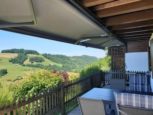 a patio with a table and chairs and a view at Chalet Traumfleck in Necker