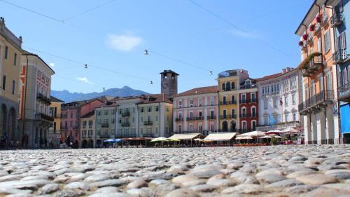 a cobblestone street in a city with buildings at Casa Reduit Terrazza in Orselina