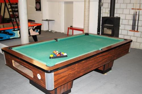 a pool table in a room with afits at Ferme D Alma in Ocourt