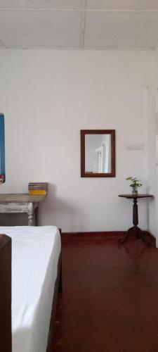 Een bed of bedden in een kamer bij Ocean breeze