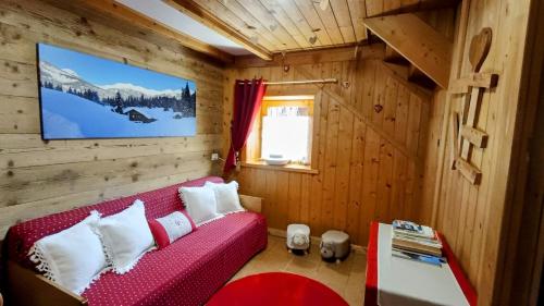 Ένα ή περισσότερα κρεβάτια σε δωμάτιο στο CaLella Vacanze Dolomiti