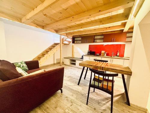 a living room with a couch and a table at Stay Inn Central Cluj in Cluj-Napoca
