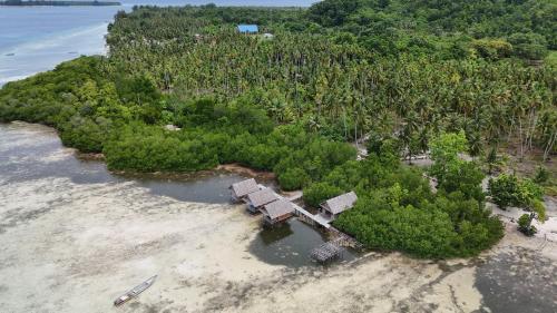 an aerial view of an island in the ocean at Mares Homestay-Raja Ampat in Fam