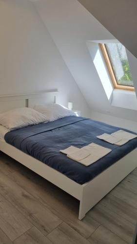 Postel nebo postele na pokoji v ubytování Nyugalom Apartman