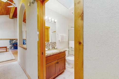 a bathroom with a toilet and a sink at The Tahoe House in Truckee